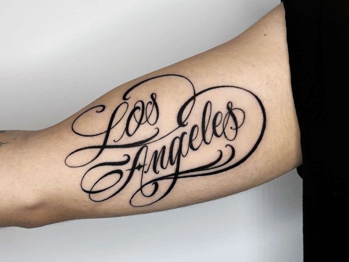 Fine script tattoo