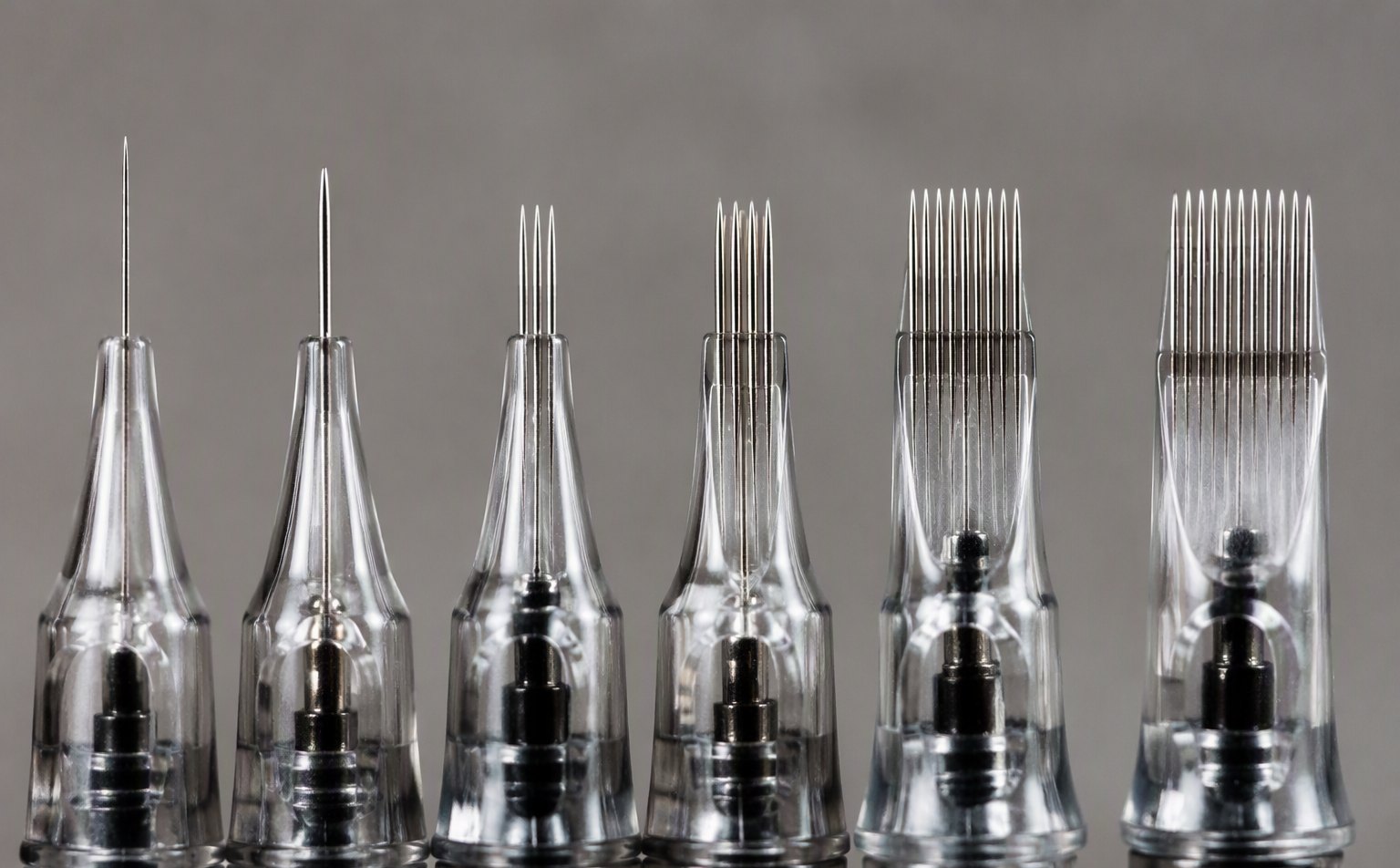 Macro comparison of tattoo needle tips in different gauges and configurations