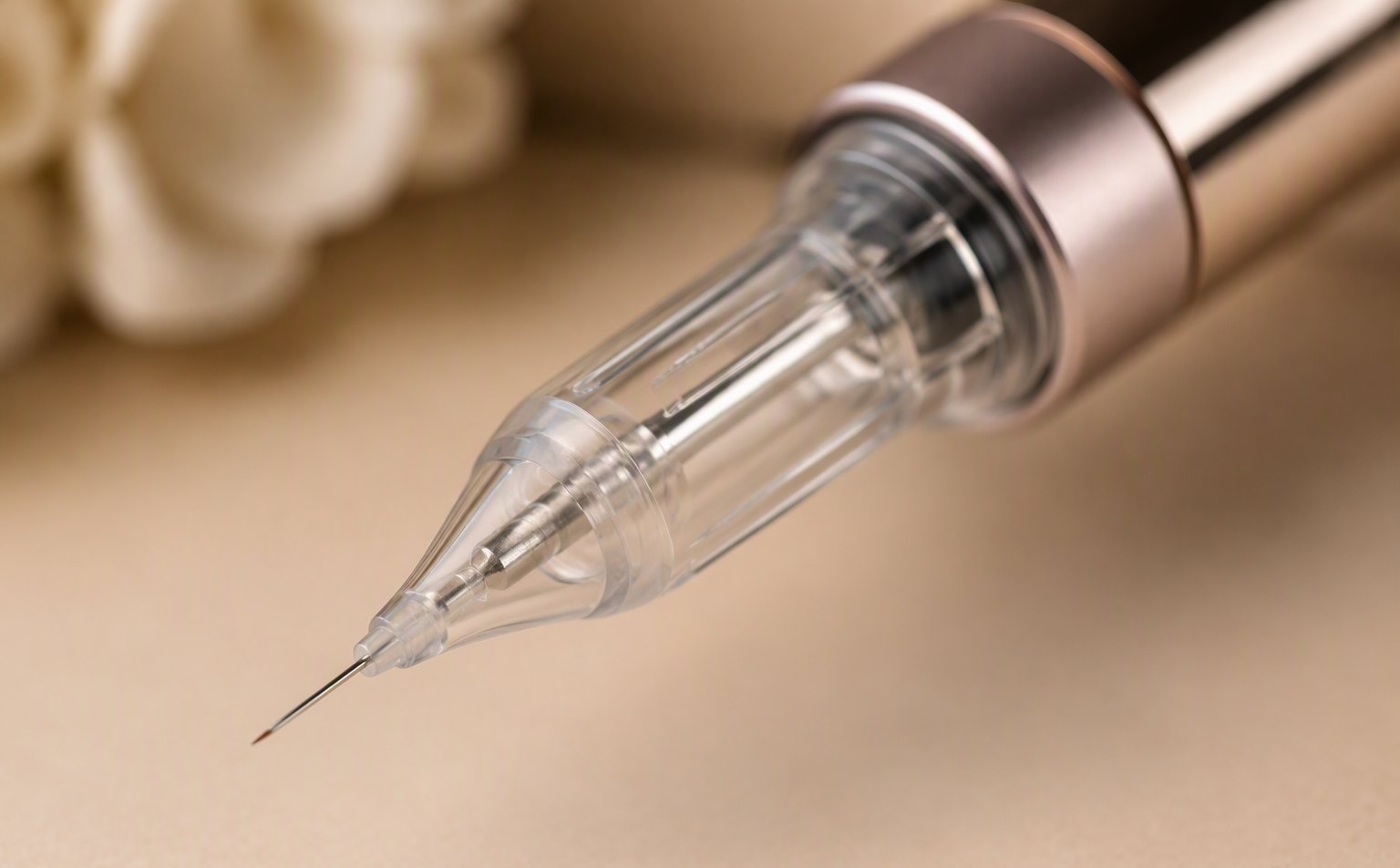 PMU pen machine with a slim needle cartridge, single fine needle in focus